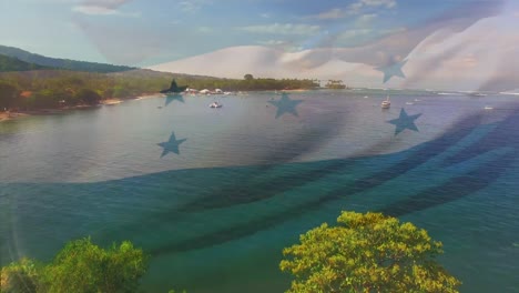 Digital-composition-of-waving-honduras-flag-against-aerial-view-of-the-sea