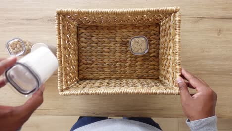 organizing nuts and seeds in a storage basket