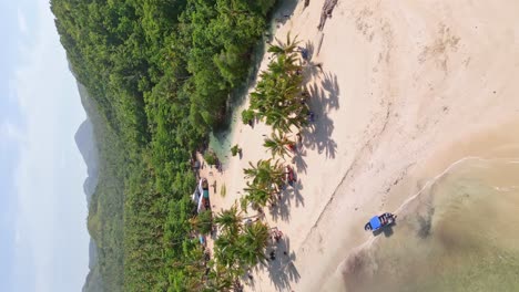 Vertical-aerial-of-Rio-Cano-Frio-where-it-enters-the-ocean-at-white-sand-beach