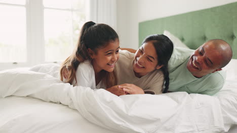 Happy,-relax-and-funny-with-family-in-bedroom