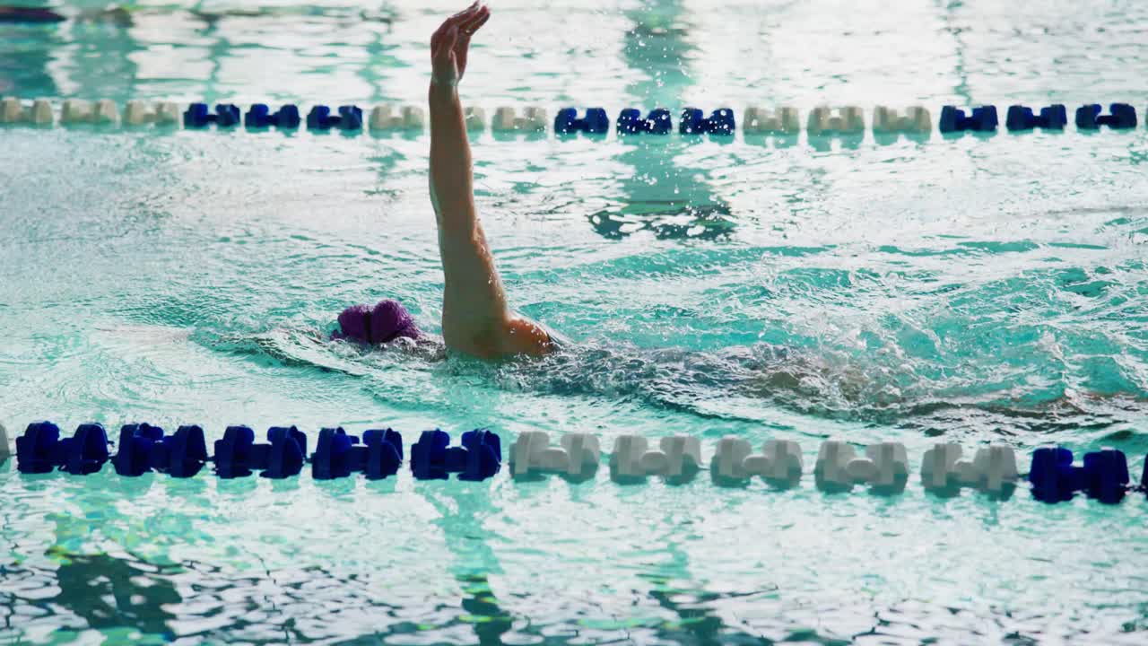 Dynamic Performance in Competitive Swimming: A Swimmer's Glide Through the Water During Practice Sessions Showcases Skill, Technique, and Determination for Excellence