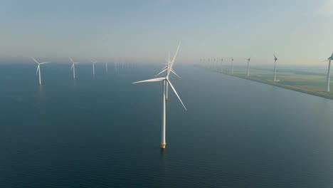 huge windmill turbines, offshore windmill farm in the ocean westermeerwind park , windmills isolated at sea on a beautiful bright day netherlands flevoland noordoostpolder