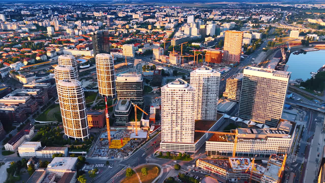 Contemporary high-rises in the urban landscape of Bratislava, Slovakia. Lots of construction sites are in the city. Aerial perspective