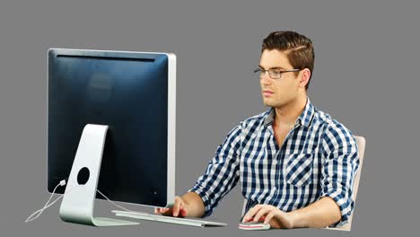 man working on desktop