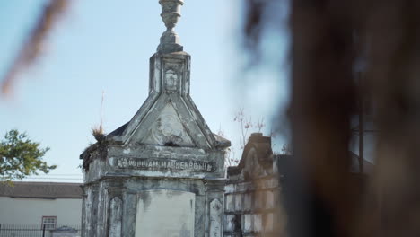 an old grave within lafayette cemetery #2 in new orleans, louisiana on a sunny, cold winter day