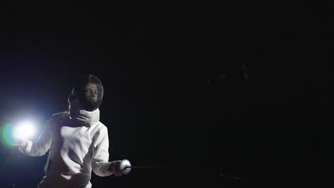 two women fencers in a competition