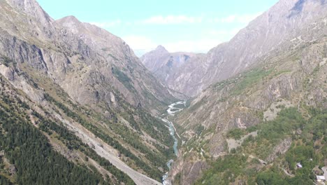 Powerful-aerial-tilting-shot-of-a-large-river-running-through-the-Verdon-Gorge-in-France