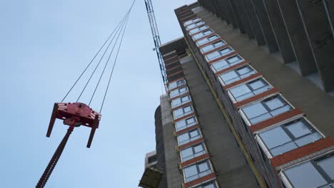 construction crane working on high-rise building