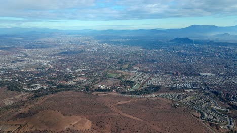 pan left aerial view of the las condes district in santiago, chile