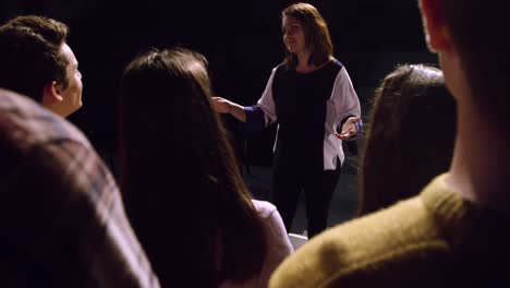 teenagers rehearsing in a theatre