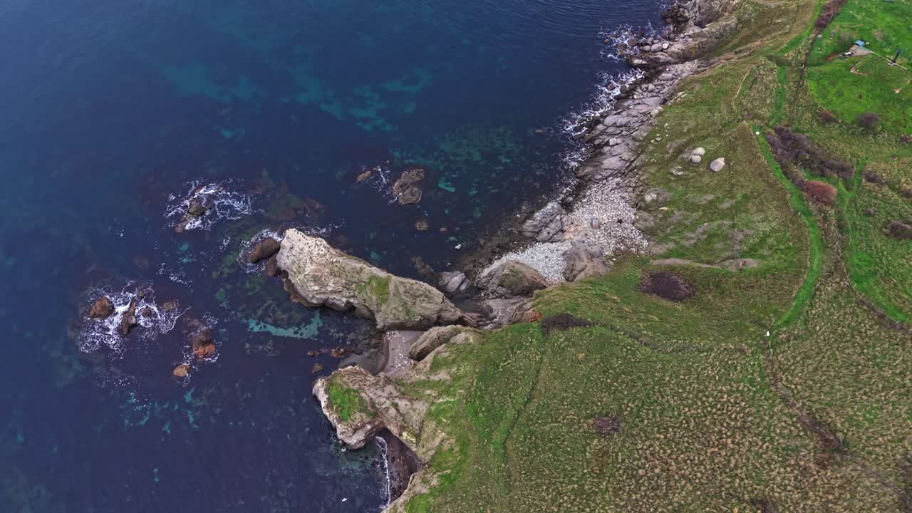 Stunning aerial view of rocky coastline and clear blue waters