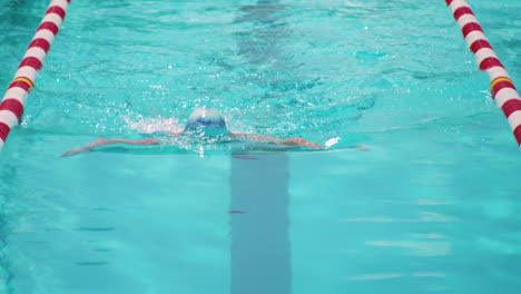 Woman-Swimmer-Doing-Breaststroke-Style-In-The-Pool