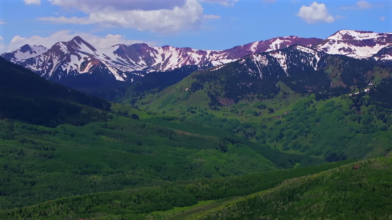 Capitol Peak 14er Wilderness spring summer aerial drone parallax Colorado Aspen Snowmass Elk Rocky Mountains Range Capitol Creek rd Trailhead Aspen grove White River Forest snow fields parallax right