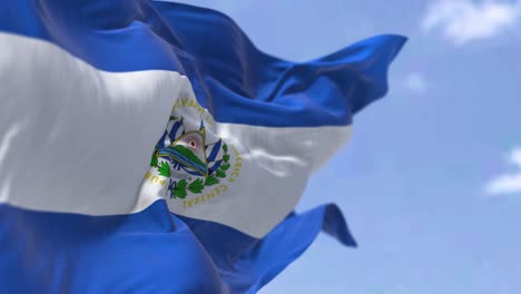 detail of the national flag of el salvador waving in the wind on a clear day