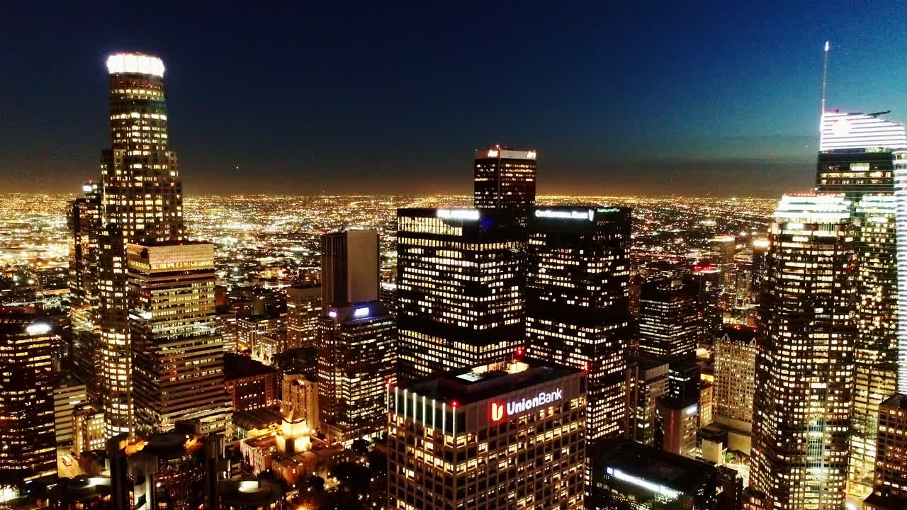 Breathtaking view of Los Angeles at night - glowing skyscrapers, drone, 4K