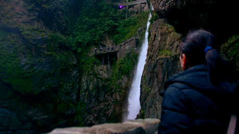 Panning-view-of-woman-seeing-a-waterfall-Devil's-Cauldron