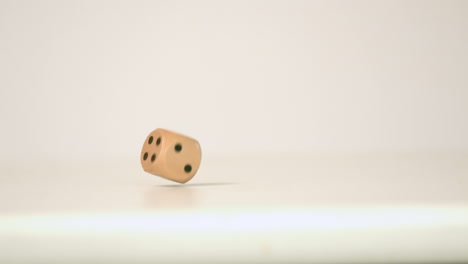 Wooden-dice-falling-and-bouncing