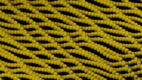 yellow 3d balls wavy movement on a black background. minimal motion graphic looped animation