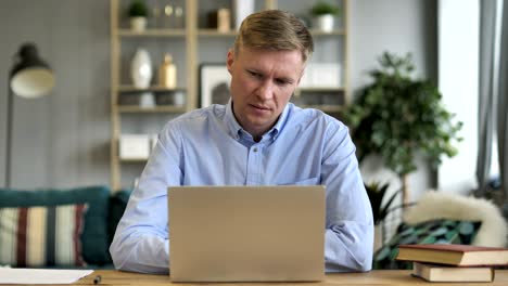 pensive businessman sitting in office