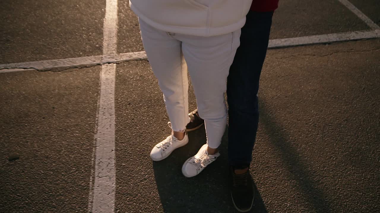 Free stock video - Pretty couple hugging while standing outdoors on the ...