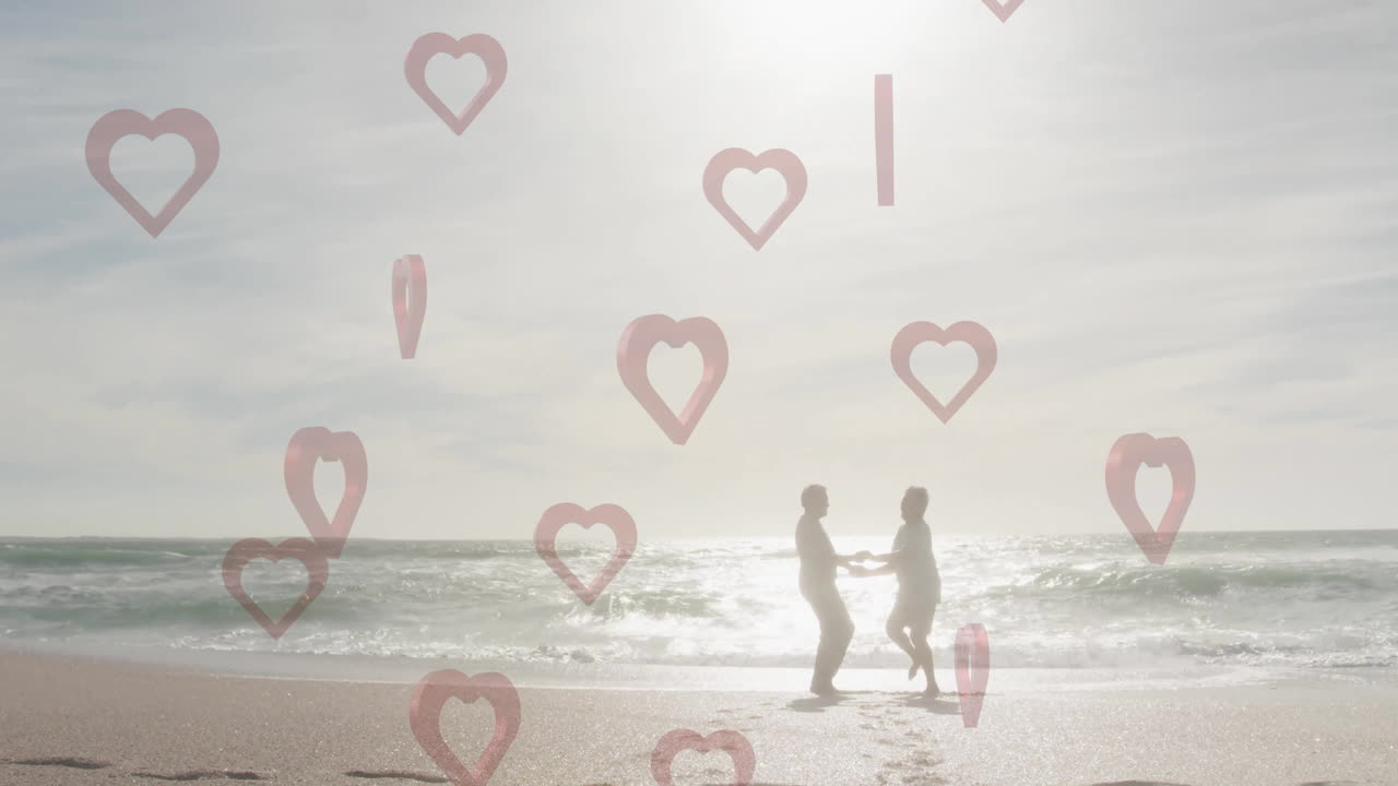 Couple holding hands on beach with heart shapes animation overlay