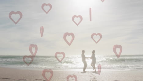 couple holding hands on beach with heart shapes animation overlay