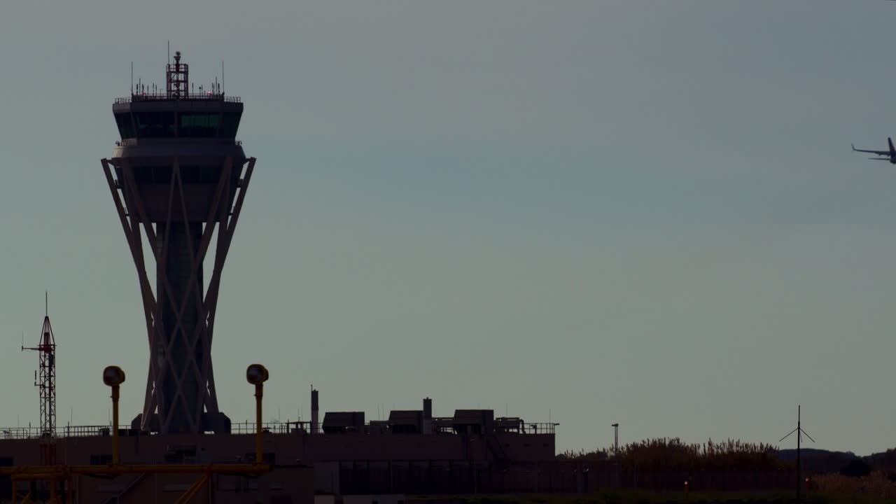 Airport Control Tower and Airplane in Flight