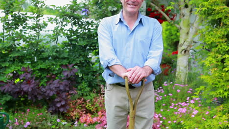 Man-standing-at-the-garden-