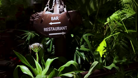 artistic bar and restaurant sigh board with green plant background