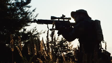 a solider aims his rifle 1