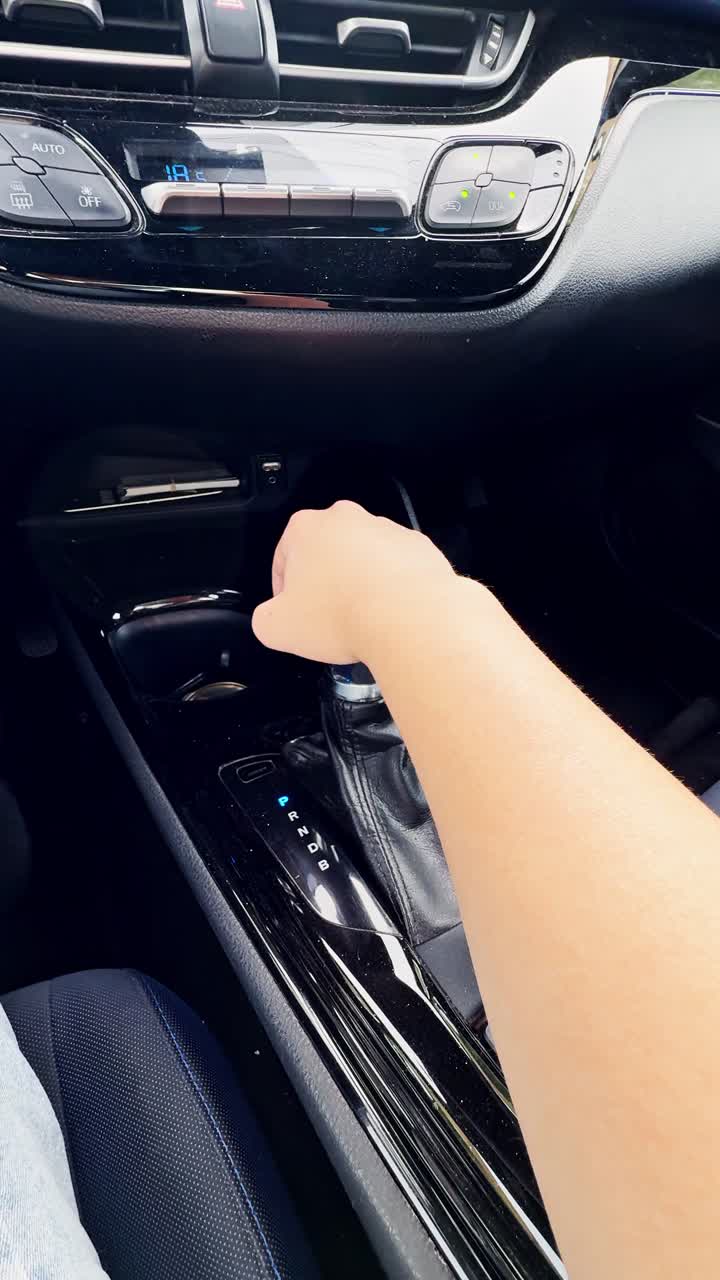 A person is driving a car and is pressing the gas pedal