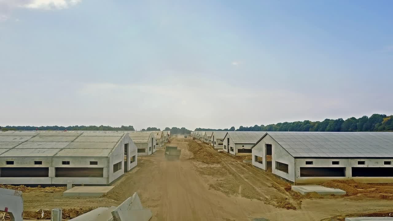 Constructing agriculture farm. Aerial view of construction site new farm for livestock in countryside