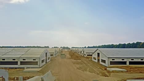 constructing agriculture farm. aerial view of construction site new farm for livestock in countryside