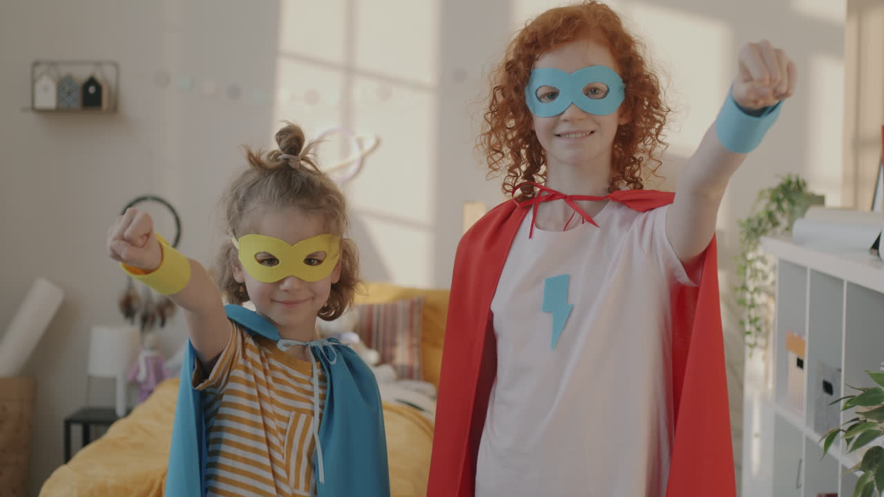 Two girls dressed up as superheroes