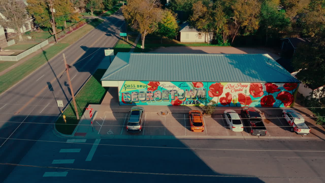 Drone fly by popular tourist destination in Georgetown, Texas, "Greetings from Georgetown" mural