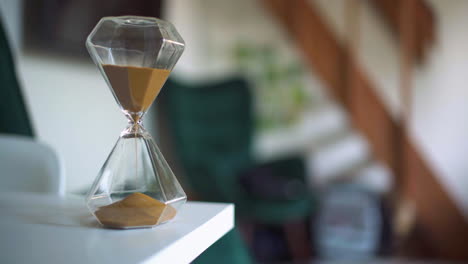 an hourglass on a table in a living room