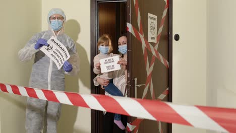 medical worker visiting family of mother and daughter at home during coronavirus quarantine lockdown