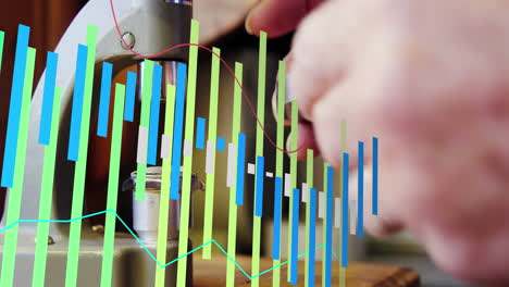 animación de gráfico sobre manos recortadas de un hombre caucásico usando equipos para reparar relojes