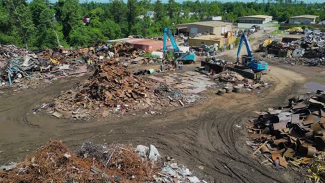 sliding-drone-view-of-scrapyard-on-a-bright-sunny-day