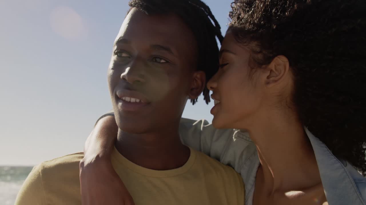 Couple embracing each other on the beach 4k