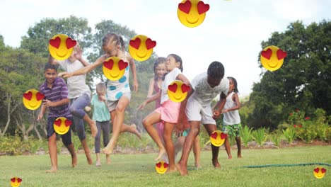 animation of falling love emoji over happy diverse children