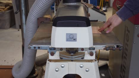 Guitar build - Man Sanding Wood to Reduce Thickness with Drum Sanding Machine at Small Factory Building Custom Instruments