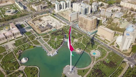 dushanbe city center landmarks and flag of tajikistan