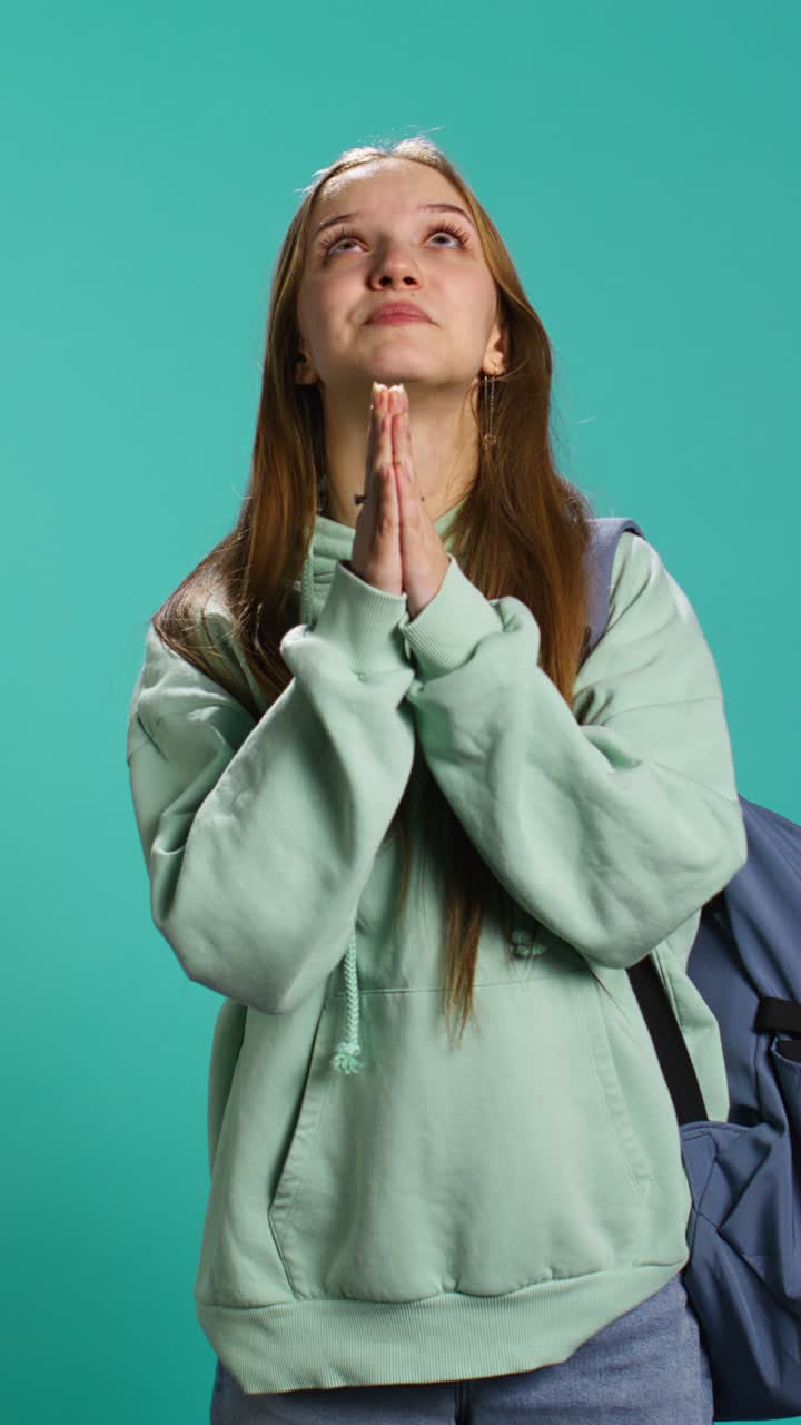 Vertical video Religious teenager doing worship hand gesturing, asking for miracle