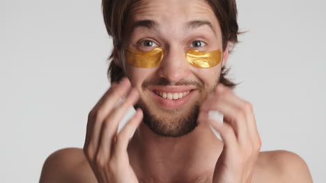 Caucasian-man-in-front-of-camera-on-white-background.