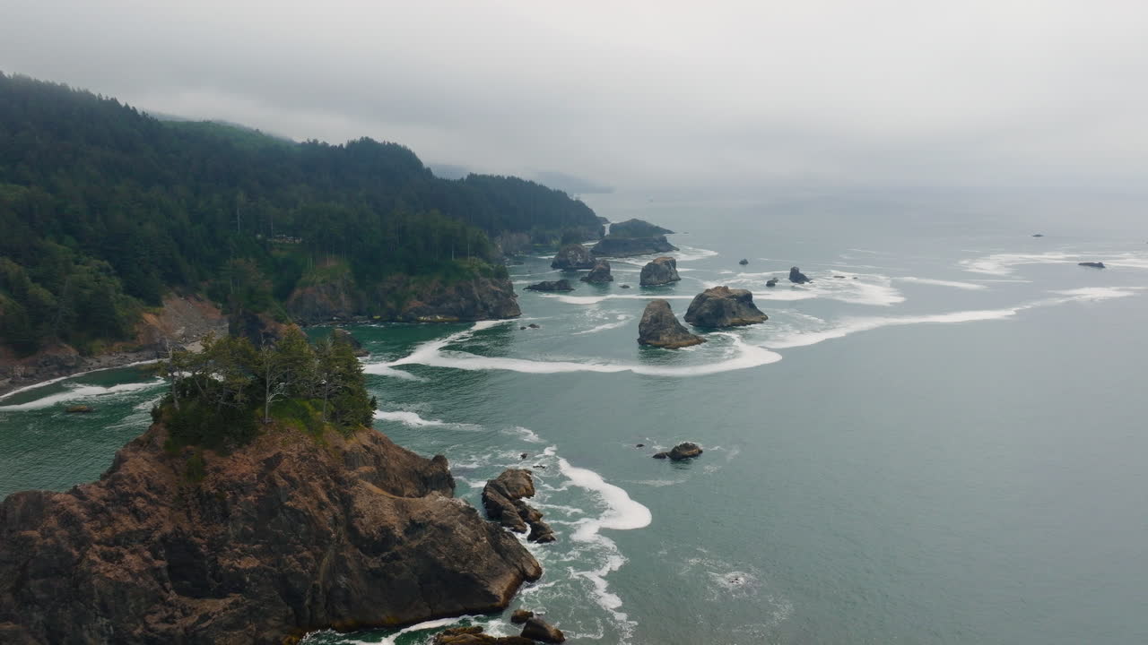 Misty Coastal Landscape with Sea Stacks and Rugged Cliffs