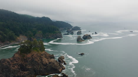 misty coastal landscape with sea stacks and rugged cliffs