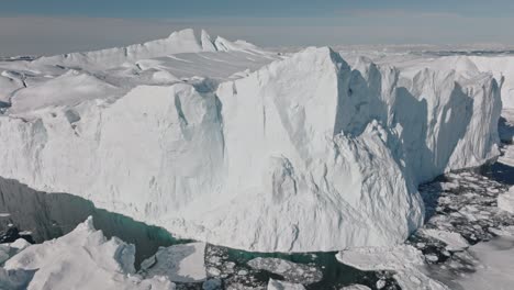 drone over sea and ice of ilulissat icefjord