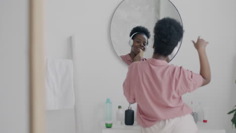 Woman Singing and Dancing in Bathroom