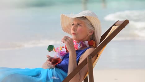 Elderly-woman-sipping-a-cocktail
